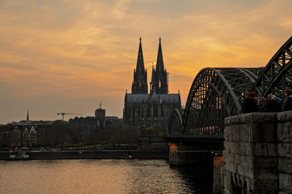 Cologne cathedral and hohenzollern bridge at sunset